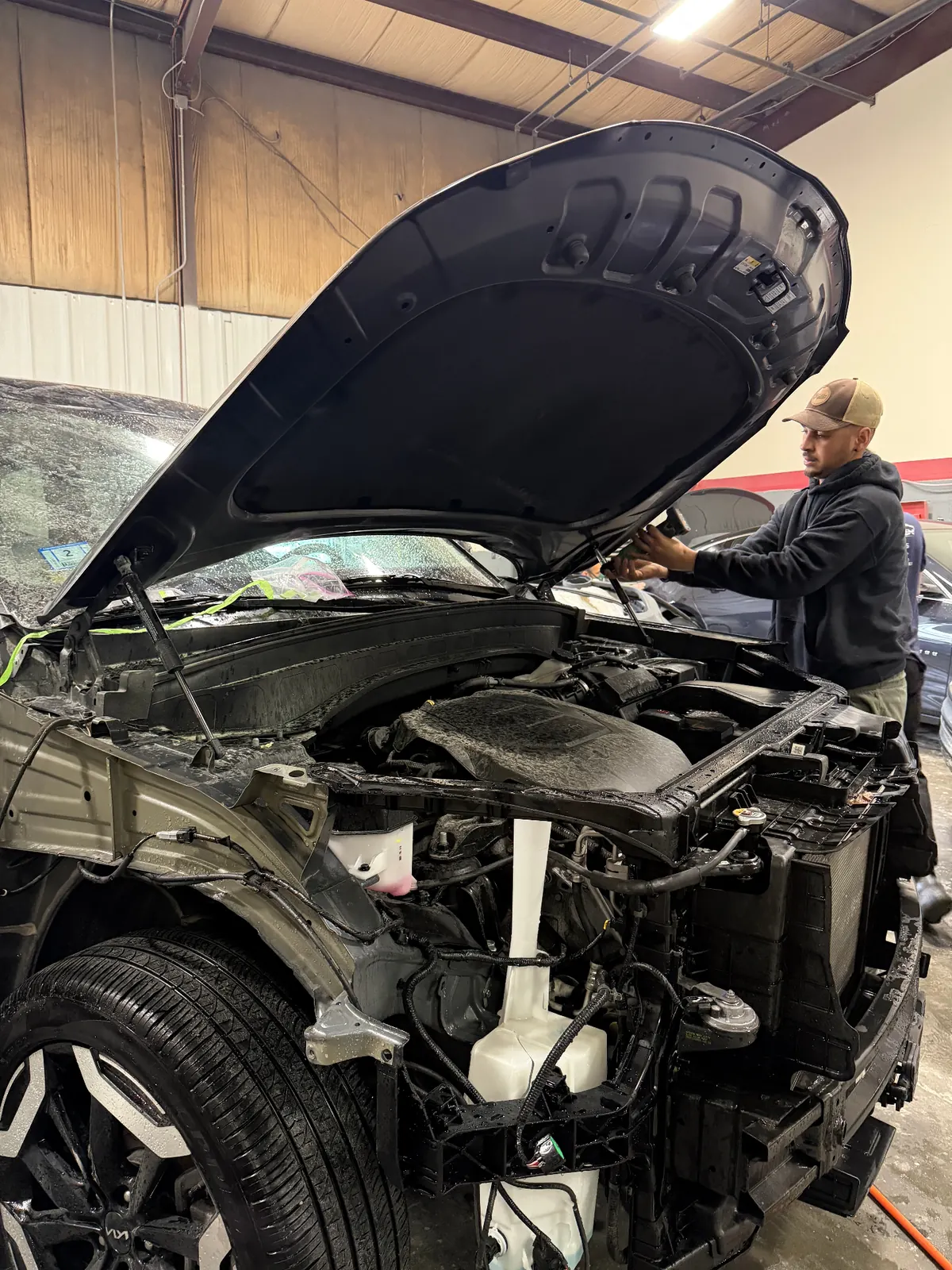 Engine bay area exposed during structural collision repair work