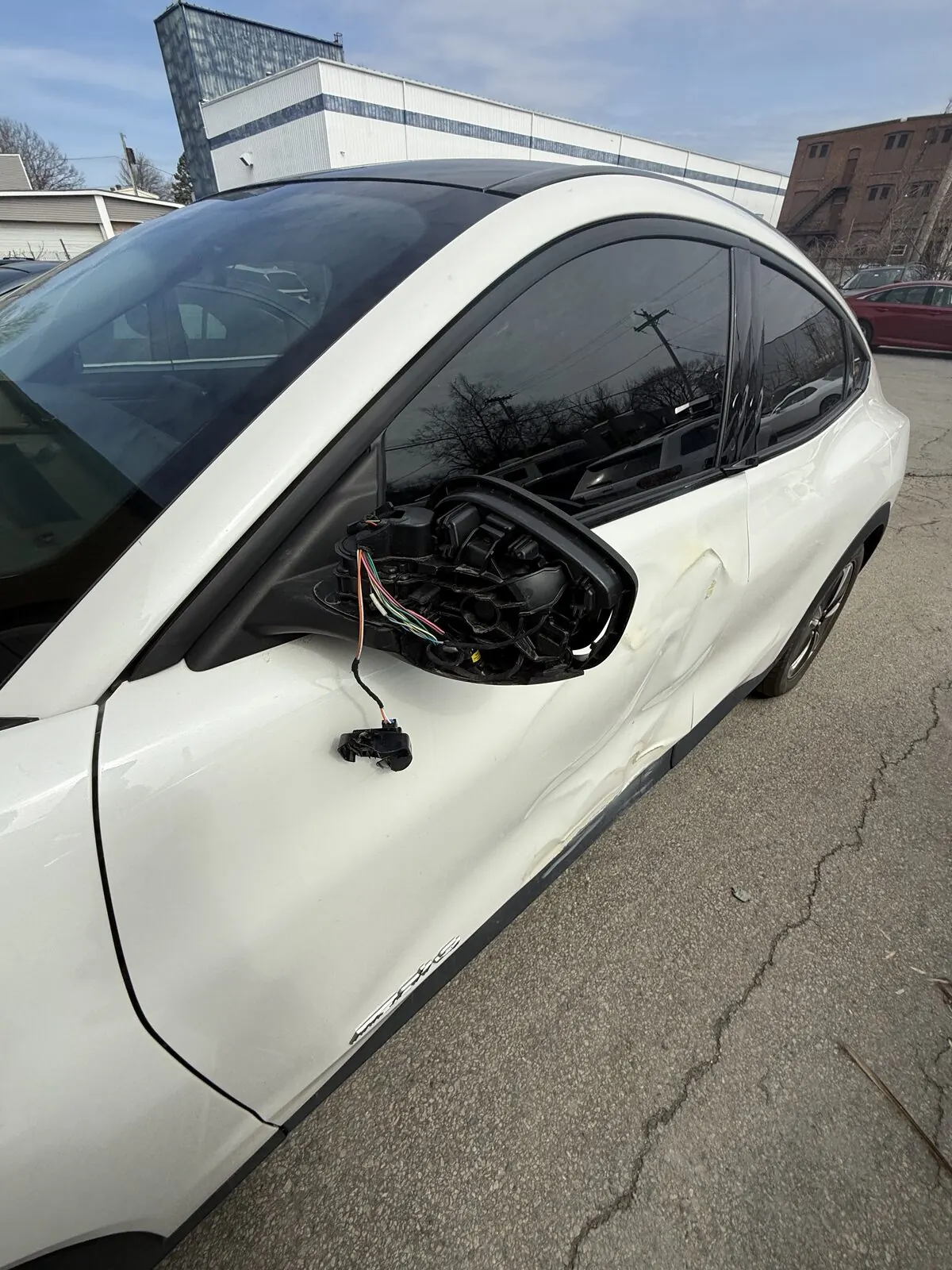 Side profile of a vehicle after door and fender repair in Worcester, MA