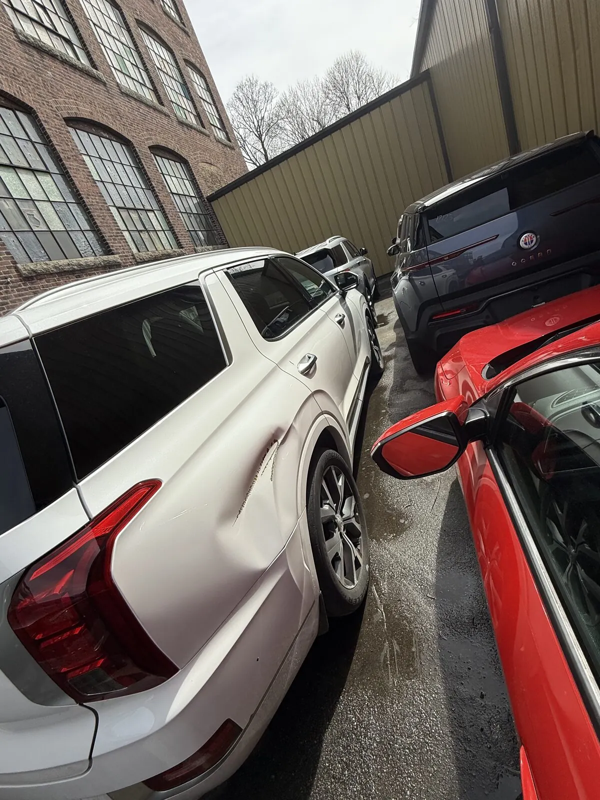 Repair bay at Best Finish Auto Body with a vehicle in for body work