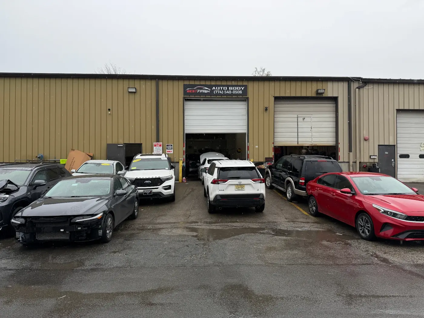 Wide view inside the Best Finish Auto Body shop on Armory Street, Worcester